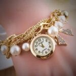 Fancy pearl bracelet watch in golden color