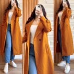 Lifestyle image styling mustard fleece coat over winter outfit