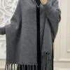Folded grey fleece shawl showing plain design