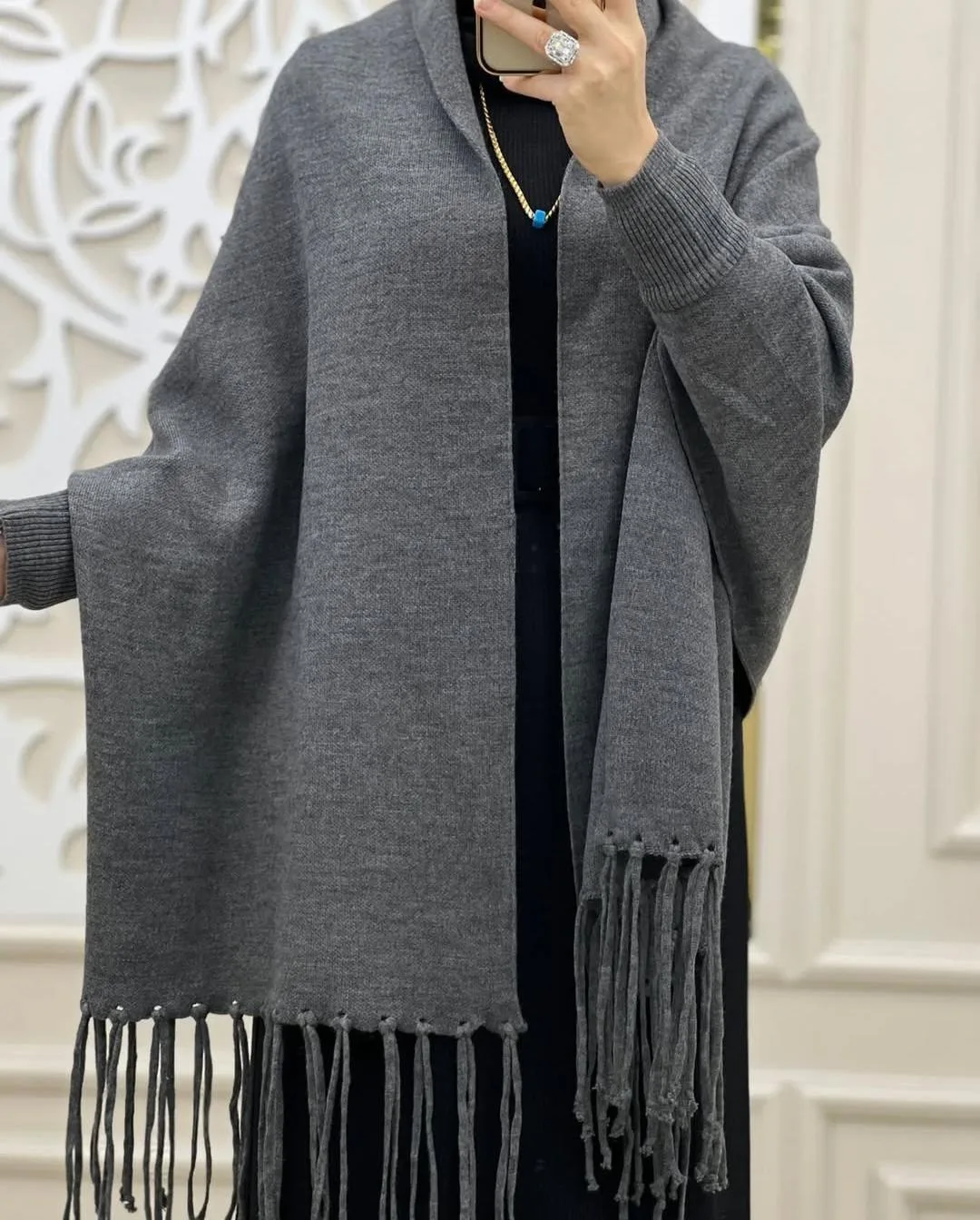 Folded grey fleece shawl showing plain design