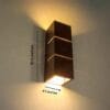 Brown wall-mounted wooden lamp with decorative design