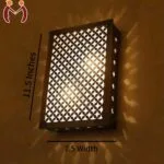 Modern decorative wall lamp with traditional patterns – dark brown MDF with golden glow