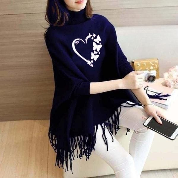 Lifestyle photo of model wearing blue printed poncho outdoors