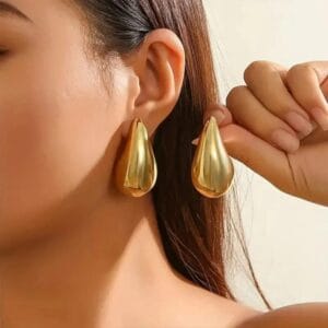 Funky gold plated artificial stone earrings in golden color
