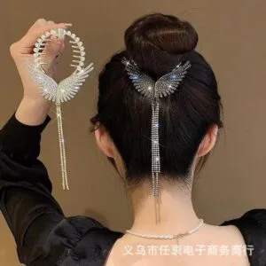 Model styling hair with butterfly design silver hair claw