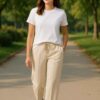 Off-white wide-leg trousers front view – women’s cotton