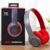 Red stereo headphones with Bluetooth and Aux support