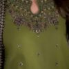 Close-up of embroidery on linen shirt and trouser