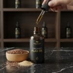 Flax seed oil with flax seeds in background – natural omega-3 oil