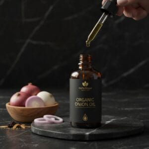 Onion oil with wooden comb and herbs – natural hair remedy
