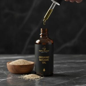 Crazy Deals 47 Bottle of pure sesame oil with sesame seeds background – til oil Pakistan